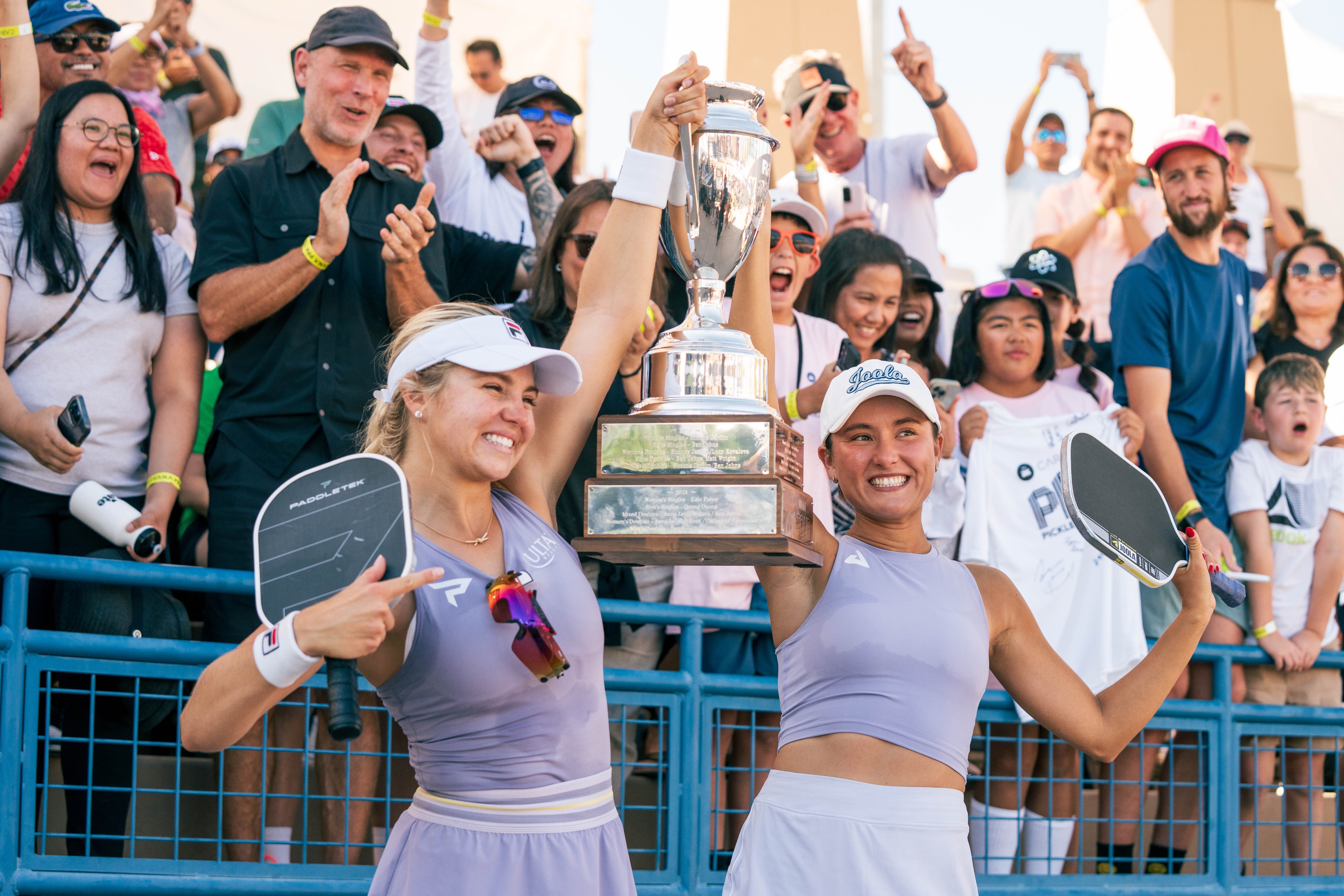 Waters and Bright Hoist the Championship Trophy